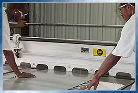 Window manufacturing in The Belize Glass Shop factory.